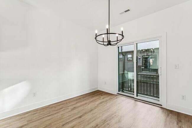 Building Photo - High-End 2BR Townhome | Rooftop Terrace + 2-Car Garage | 24-Unit Commnity