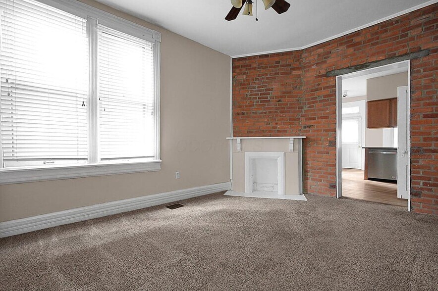 Dining room with kitchen in background - 328 W 1st Ave