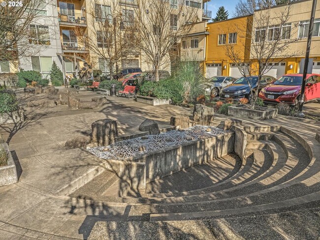 Building Photo - Main Street Living with Granite Kitchen, Gas Fireplace, and MAX Line Access