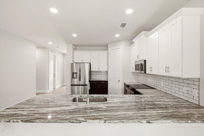 Building Photo - Brand New Canal-Front Pool Home for Rent, 3/2/2, NE Cape Coral. The Builder Didn't Cut Corners, S...