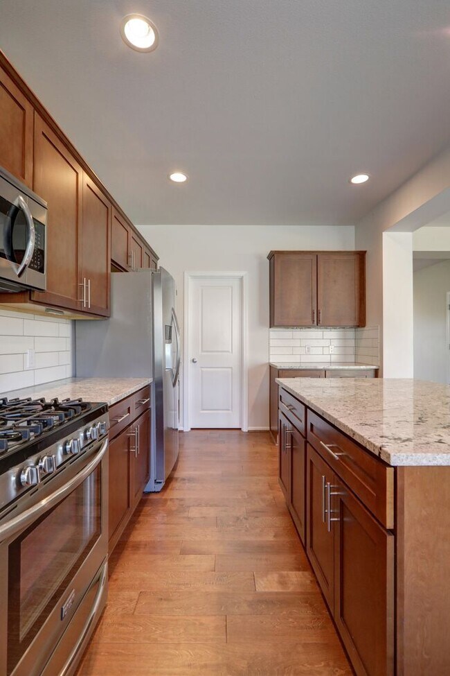 Building Photo - 4 Bedroom Home with Open Den, Living & Family Rooms – Space for Everyone