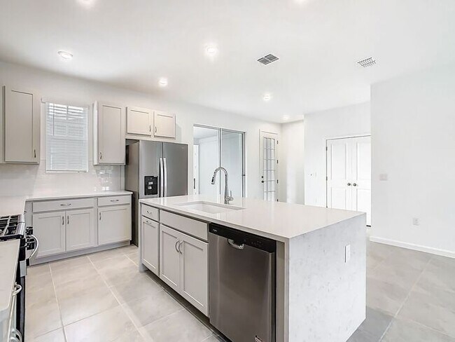 Building Photo - New Luxury Townhome in Celebration with All porcelain tiled floors. Island Village new construction