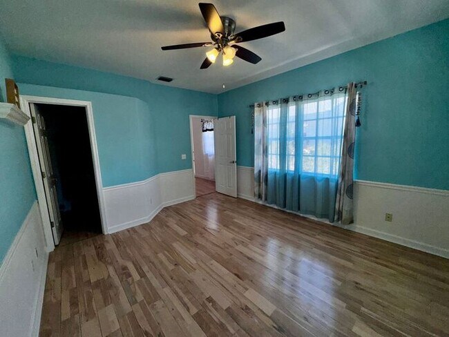 Building Photo - 3 Bedroom 2.5 Bath Cinnamon Bay Home with Stunning view, and Hardwood Flooring!
