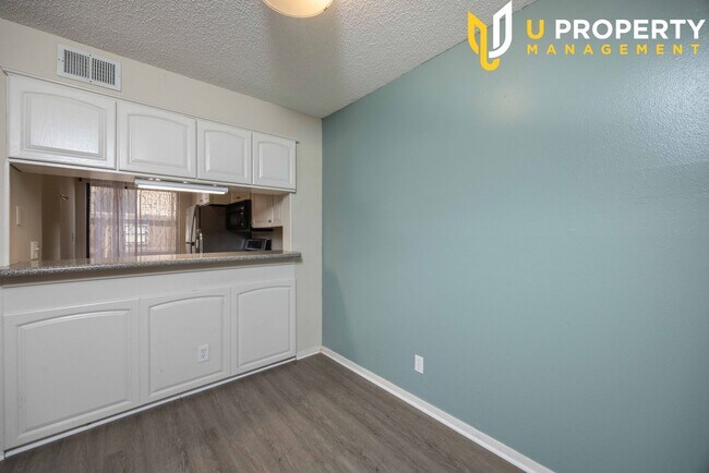 Building Photo - Updated Condo with New Vinyl Flooring & Ne...