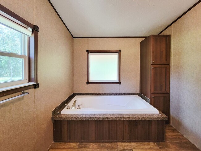 Building Photo - Cozy and Adorable home 4 bedroom 2 bath home on over 1 acre near McRae Lake! Relax on the covered...