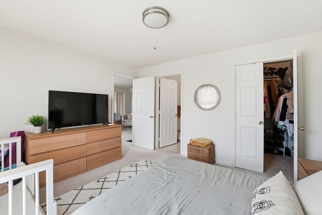 Building Photo - Bathed in natural light, this stunning second level condominium offers an effortless blend of com...