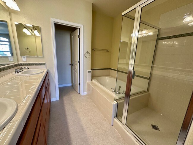 Building Photo - TOWNHOME WITH THOUGHTFUL UPGRADES | CALM SETTING