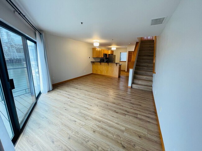 Building Photo - Top Floor 1bdrm Condo with River Views and Private Deck | Most Utilities & Parking Included!