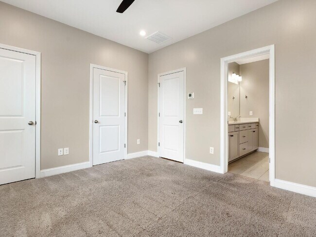 Building Photo - The Towns on Greenway! Two bedrooms. Two private baths, Half Bath. Greenway around the corner. Up...