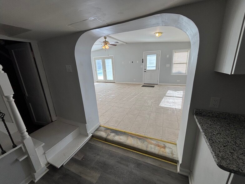 view to Family Room/dining room from kitchen - 210 Boston Dr