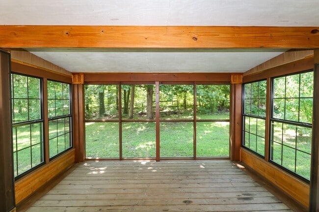 Building Photo - Two Bedroom, 2 Bath, 1-Car Garage, 1179 sq ft feet home with wood burning fireplace. and screened...