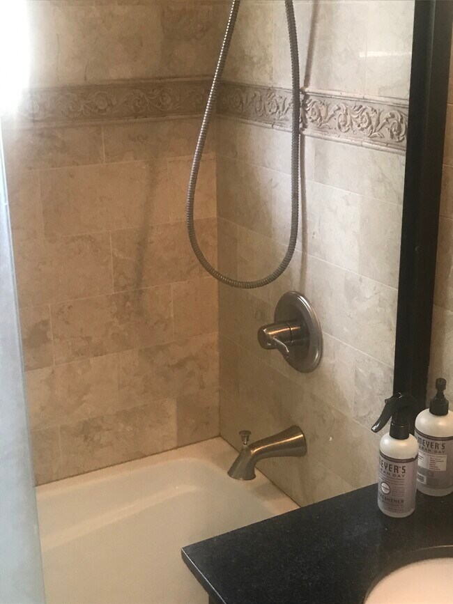 Wonderfully remodeled bathroom with marble tiles. - 1857 Pandora Ave