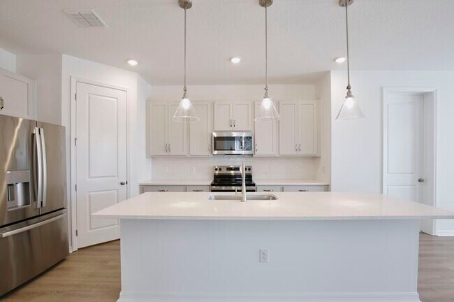 Building Photo - Stylish Sunbrooke Sanctuary! Modern 4/2 Ho...