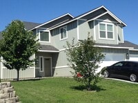 Building Photo - 4 Bedroom home 3 car garage fenced yard
