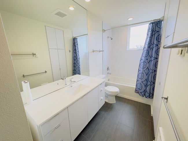 Building Photo - 3 Bedroom Central District Townhome w/ Garage, AC & Rooftop Deck