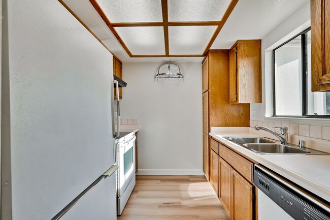 Building Photo - New Vinyl Plank Flooring, Fresh Interior Paint, 1 Car Garage + 1 Assigned Outdoor Parking Space -...