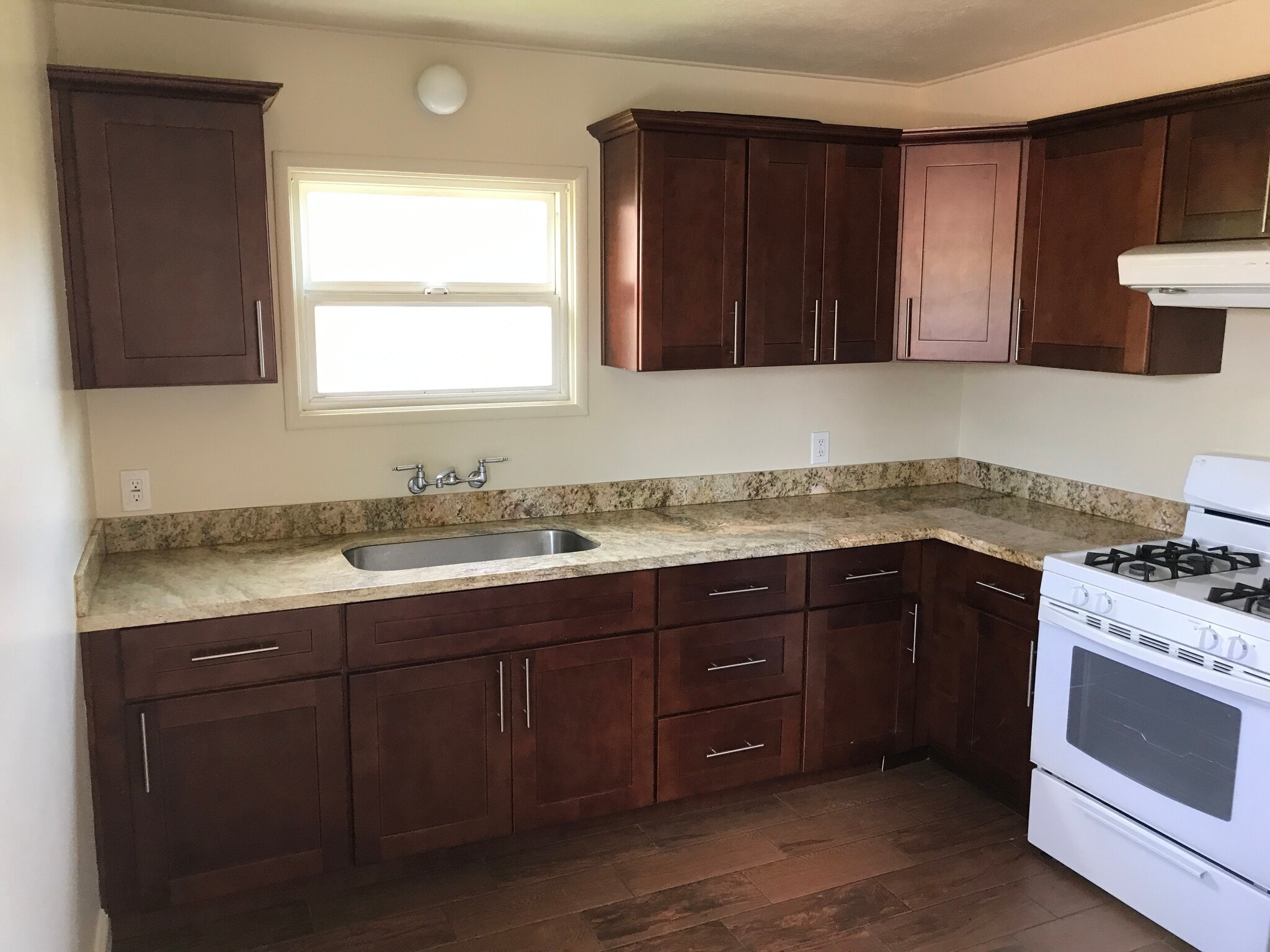 Granite counters with gas range new cabinets - 124 Lewelling Blvd