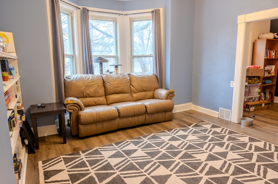 Living room with an attached den/office, perfect for work or relaxation. - 1534 N Marshall St