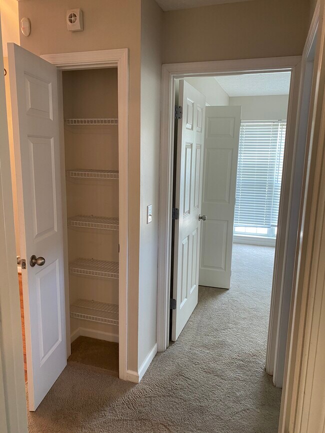 Entry hallway with linen closet - 709 Warmstone Ct