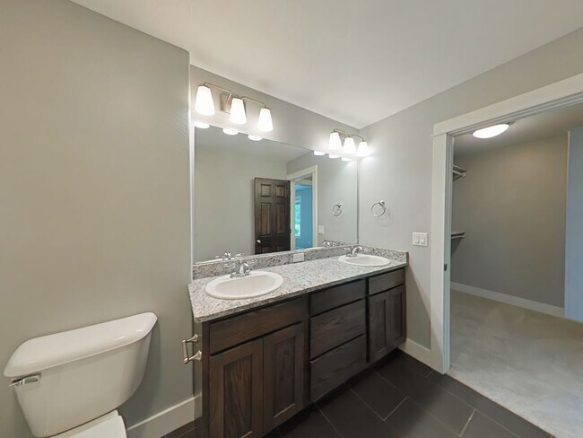 Building Photo - Stunning 3-bedroom, 2.5-bathroom condo with attached 2 stall garage!