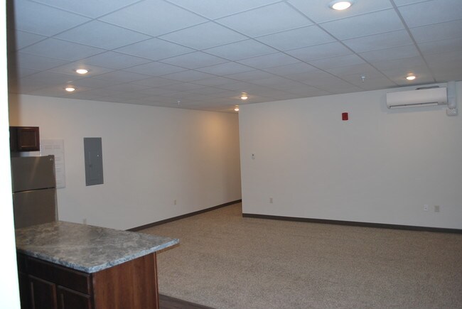 Building Photo - Essential Living - market rate apartments