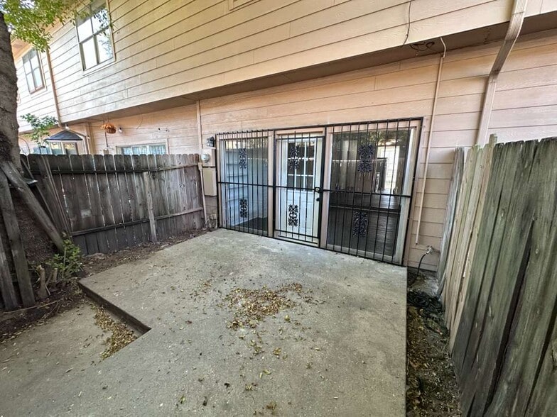 Cozy private patio: perfect for enjoying your morning coffee or outdoor seating - 7700 Creekbend Dr