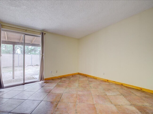 Building Photo - Charming 4-Bedroom Home with Spacious Living & Private Backyard!