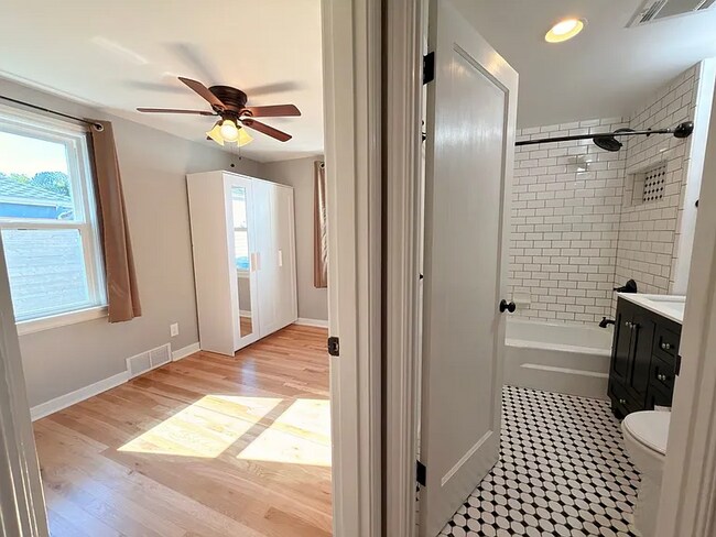 Building Photo - This spacious four-bedroom, two-bathroom
