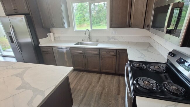 Building Photo - This 3-bedroom, 2-bath home in Orchidland Subdivision