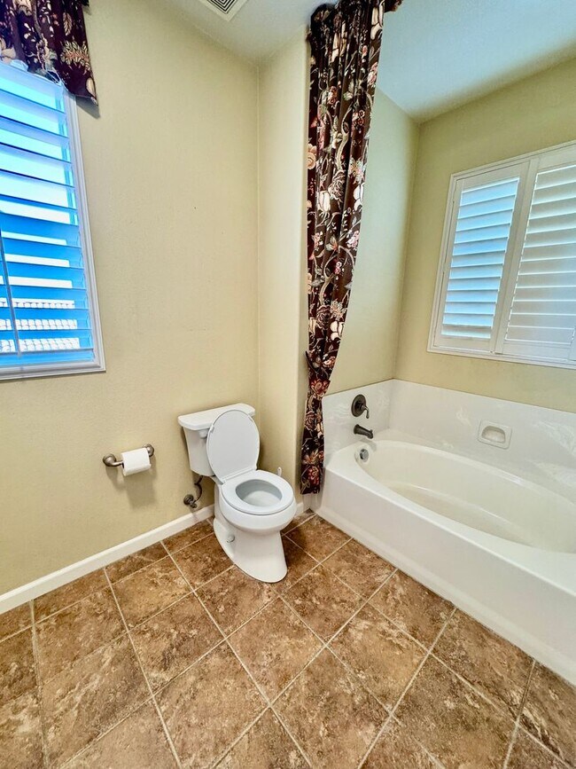 Building Photo - Located in a peaceful and well-maintained senior community, this spacious 3-bedroom, 3.5-bath Plu...