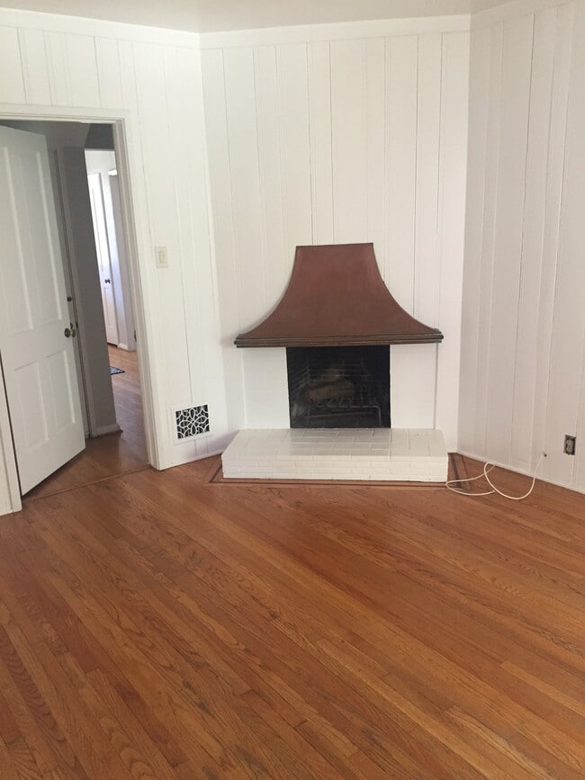 Beautiful Fireplace in den with book shelves - 3037 Motor Ave