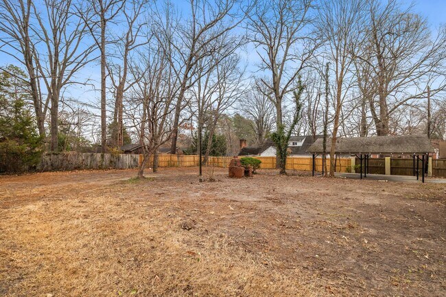 Building Photo - Brick home, Two Story, Hardwoods, DR, 2 Sun Rooms, FP, Carport!.