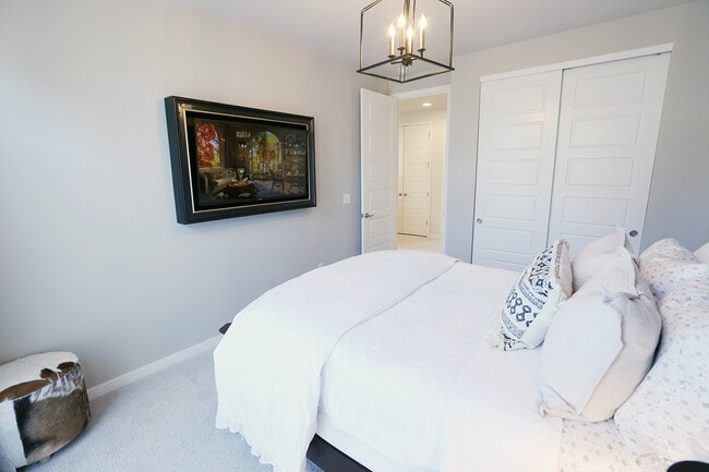 Guest bedroom #1. Has raised plug for mounting a TV. - 15637 E Broncos Pl