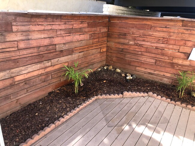 Building Photo - Beautiful Townhome with large fenced back patio, second story balcony, and two covered parking spots
