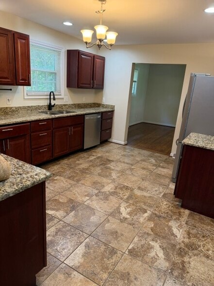 Kitchen View 1 - Granite Countertops and Stainless-Steel Appliances - 6006 Stone Pine Rd