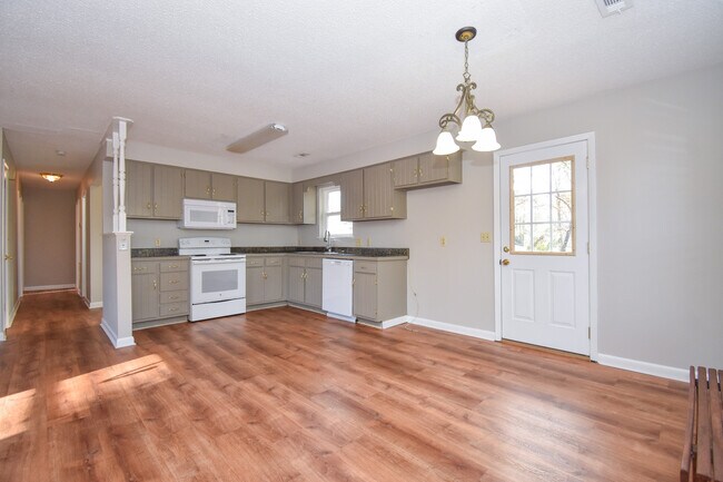 The kitchen comes with a fridge (installed after this photo). - 111 Wilder St
