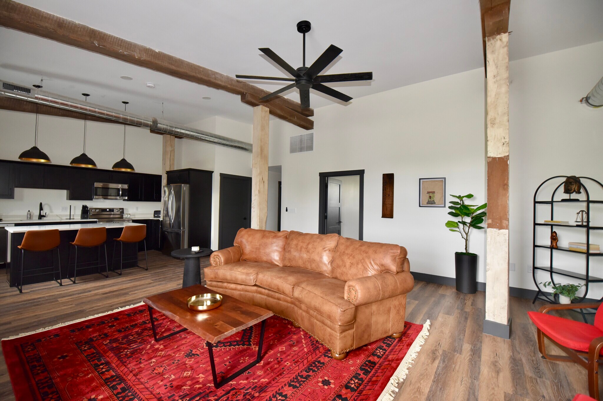 Open layout with ample seating areas in living room and breakfast bar. - 101 W Broadway St