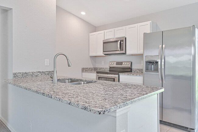 Building Photo - Spacious Three-Bedroom Home with Open Floor Plan, Large Yard