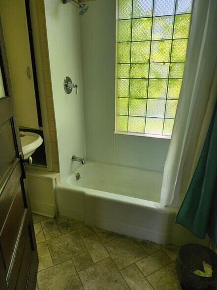 Tub and shower. - 1754 N Humboldt Ave