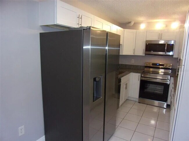 Building Photo - 2-Bed, 2-Bath Condo Retreat in Serene Tarpon Springs Oasis!