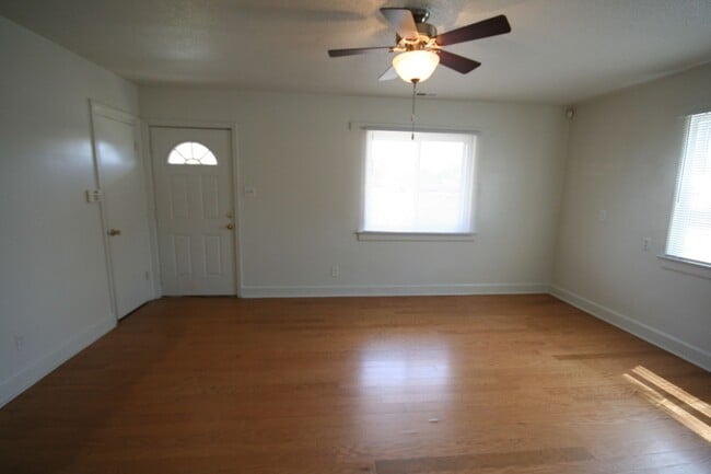 Building Photo - Two bedrooms, hardwood throughout, and a private driveway — all under $1,400 near Duke West.