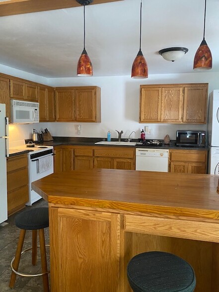 Built-in table with stools and storage beneath - 416 E Decker St