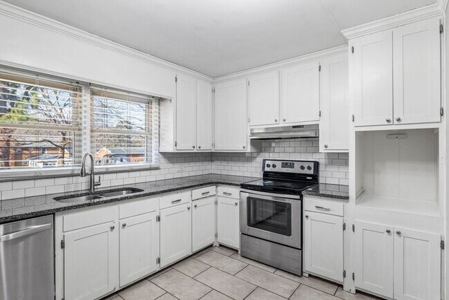 Building Photo - Elon - Large Brick Home, Hardwoods, Granite Counter-Tops, SS Appliances, Fire Place, Carport - Mu...