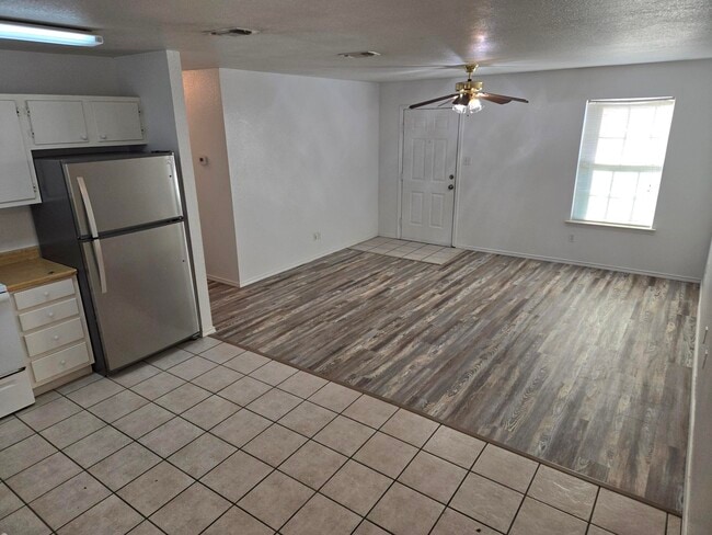 UNIT E, living room and kitchen area - 605 College St