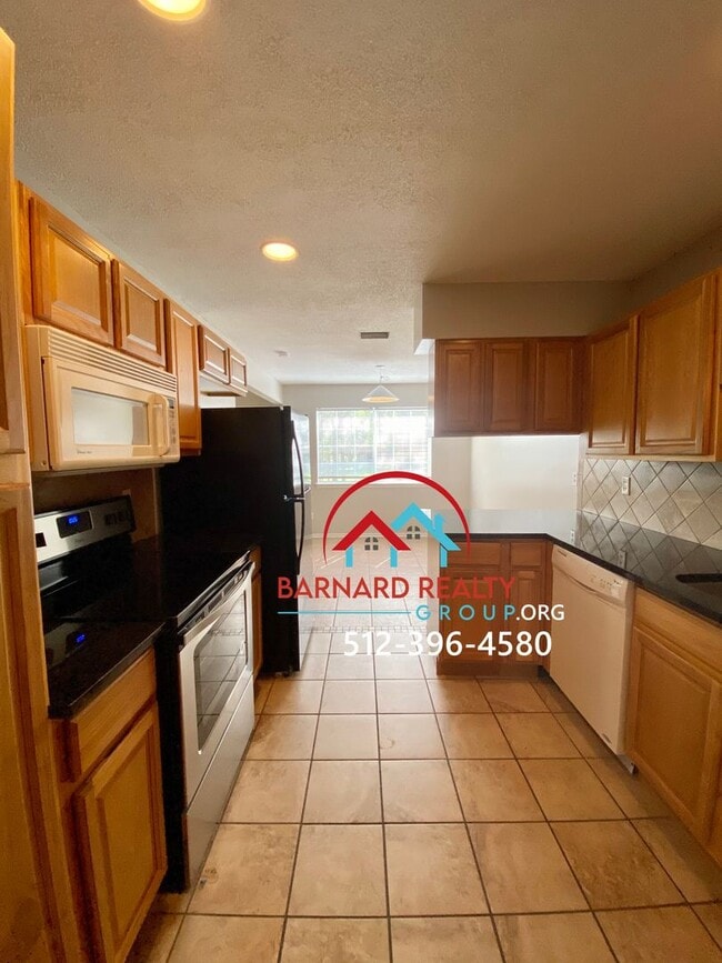 Building Photo - Available July 11: 3 bedroom, 2.5 Bath Duplex with Garage and Fenced Yard