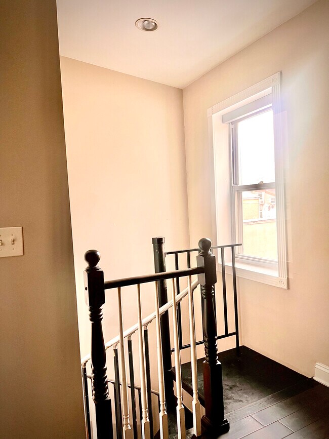 top of spiral stairs with plenty of natural light - 1926 Fleet St