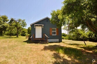 Building Photo - FOR LEASE - 1 BR - 1 BA Frame Home on Larg...