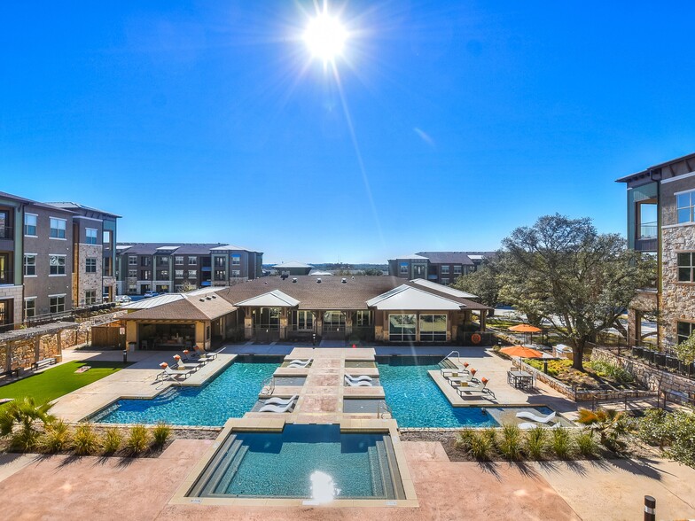 Resort-style Swimming Pool with Tanning Ledges - Bexley Wolf Ranch