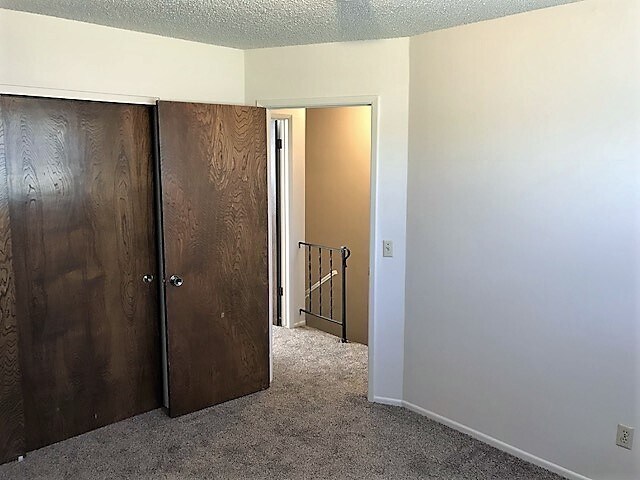 Building Photo - 2 Bedroom Townhouse with Fenced Yard by Harloe Elementary School