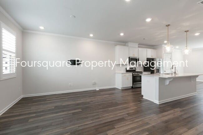 Building Photo - Stylish 3-Level Townhome with Bonus Suite, Deck & Garage – Near I-540 and Shopping